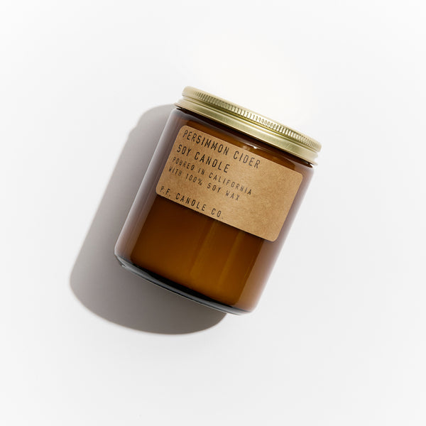 P.F. Candle Co. EU Persimmon Cider Standard Candle - Product - Hand-poured into apothecary inspired amber jars with our signature kraft label and a brass lid.