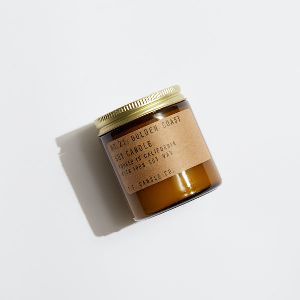 P.F. Candle Co. EU Golden Coast Mini Candle - Product - Our 3.5 oz Mini Candles are hand-poured into apothecary inspired amber jars with our signature kraft label and a brass lid.