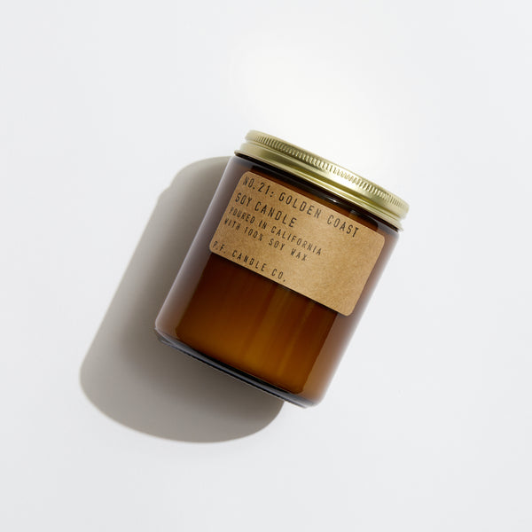 P.F. Candle Co. EU Golden Coast Standard Candle - Product - Hand-poured into apothecary inspired amber jars with our signature kraft label and a brass lid.