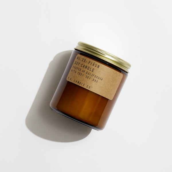 P.F. Candle Co. EU Pińon Standard Candle - Product - Our 7.2 oz Standard Candles are hand-poured into apothecary inspired amber jars with our signature kraft label and a brass lid. This is our most popular size and is meant for dressers, countertops, nightstands – basically everywhere.