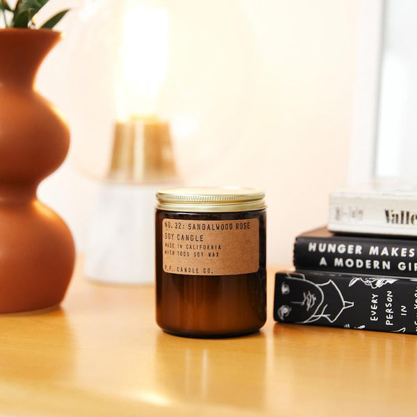 P.F. Candle Co. EU Sandalwood Rose Standard Candle - Lifestyle - New York meets Los Angeles. Cashmere rose, oud, and sandalwood.