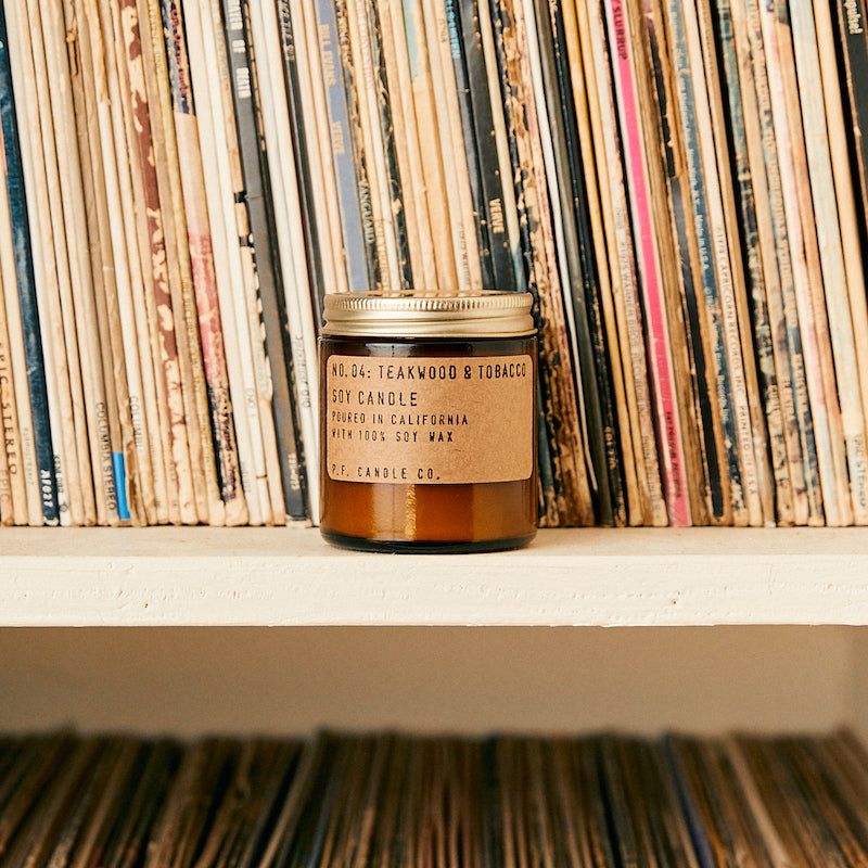 P.F. Candle Co. EU - No. 04: Teakwood & Tobacco 3.5 Oz Mini Soy Candle - Lifestyle - The one that started it all. Some call it the boyfriend scent, we call it the O.G. Leather, teak, and orange.