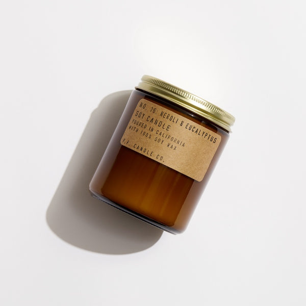 P.F. Candle Co. EU Neroli & Eucalyptus Standard Candle - Product - Hand-poured into apothecary inspired amber jars with our signature kraft label and a brass lid.