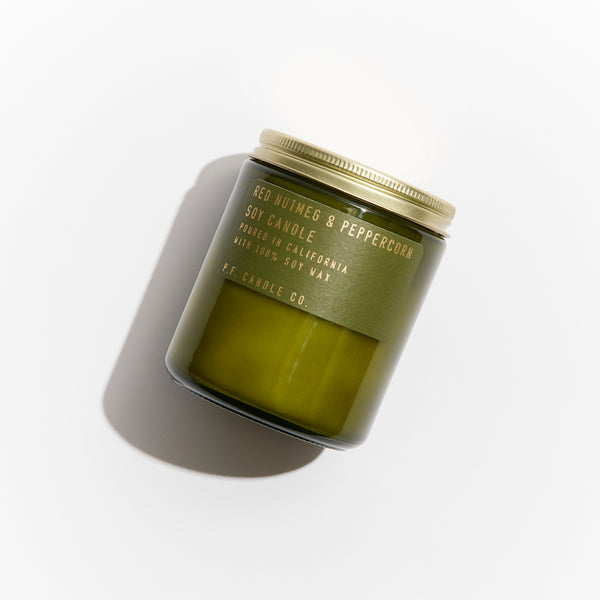 P.F. Candle Co. EU Red Nutmeg & Peppercorn Limited Candle - Hand-poured into apothecary inspired amber jars with our signature kraft label and a brass lid.