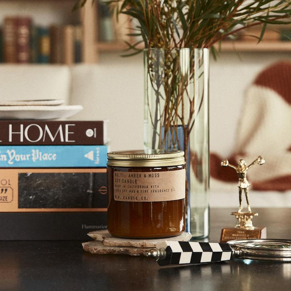 P.F. Candle Co. EU - Amber & Moss Classic Large 12.5 oz Scented Soy Wax Candle - Lifestyle -  Scent notes of sage, moss, and lavender. Inspired by a weekend in the mountains, sun gleaming through the canopy.