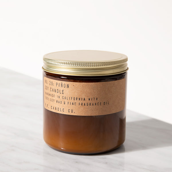 P.F. Candle Co. EU - Piñon– 12.5 oz Soy Candle - Our 12.5 oz Large Candles are hand-poured into apothecary-inspired amber jars with our signature kraft label and a brass lid.