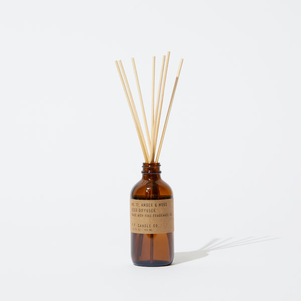 P.F. Candle Co. EU - Amber & Moss Classic 3.5 fl oz Scented Reed Diffuser - Product - Apothecary-inspired amber glass bottles with our signature kraft label and rattan reeds. Low-maintenance scent throw, all day long - no match necessary.