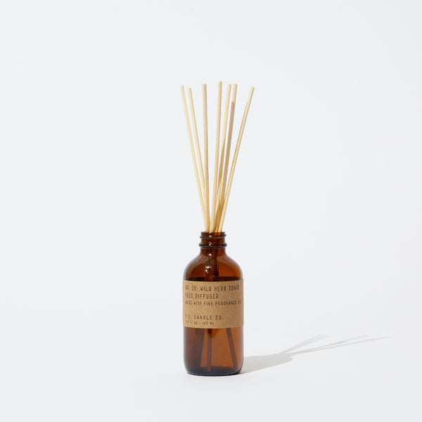 P.F. Candle Co. EU - Wild Herb Tonic Classic 3.5 fl oz Scented Reed Diffuser - Product - Apothecary-inspired amber glass bottles with our signature kraft label and rattan reeds. Low-maintenance scent throw, all day long - no match necessary.