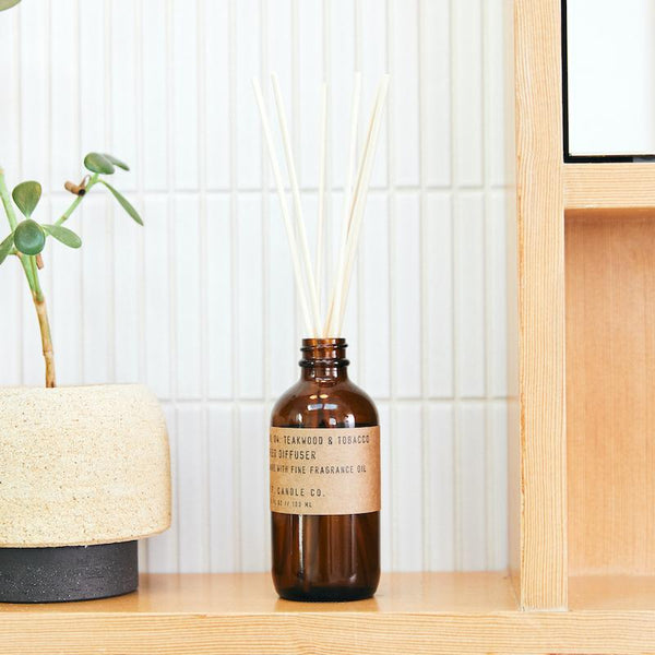 P.F. Candle Co. EU - Teakwood & Tobacco Classic 3.5 fl oz Scented Reed Diffuser - Lifestyle - The one that started it all. Some call it the boyfriend scent, we call it the O.G. Leather, teak, and orange.