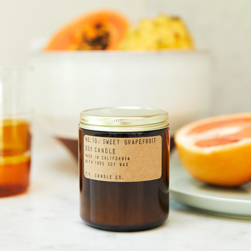 P.F. Candle Co. EU Sweet Grapefruit Standard Candle - Lifestyle - Ice cold lemonade. Dinner on the patio with your favorite people. Grapefruit, yuzu, and lemon