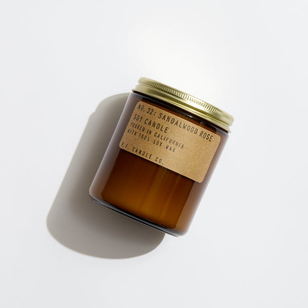 P.F. Candle Co. EU Sandalwood Rose Standard Candle - Product - Our 7.2 oz Standard Candles are hand-poured into apothecary inspired amber jars with our signature kraft label and a brass lid. This is our most popular size and is meant for dressers, countertops, nightstands – basically everywhere.