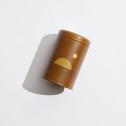 P.F. Candle Co. EU Dusk Sunset Candle - Product - Poured into custom-printed tin vessels donned with earth-toned motifs, sun shapes, and horizon lines inspired by California scenery.