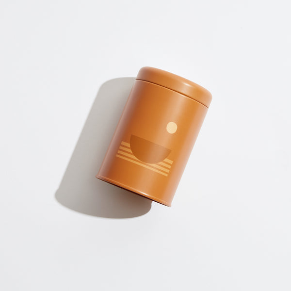 P.F. Candle Co. EU Swell Sunset Candle - Product - Poured into custom-printed tin vessels donned with earth-toned motifs, sun shapes, and horizon lines inspired by California scenery.